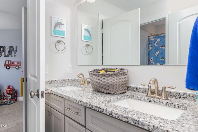 full bath with double vanity and a sink