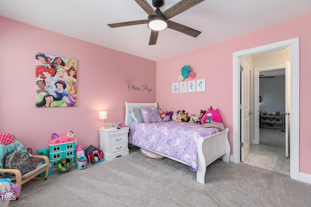 bedroom featuring a ceiling fan and carpet