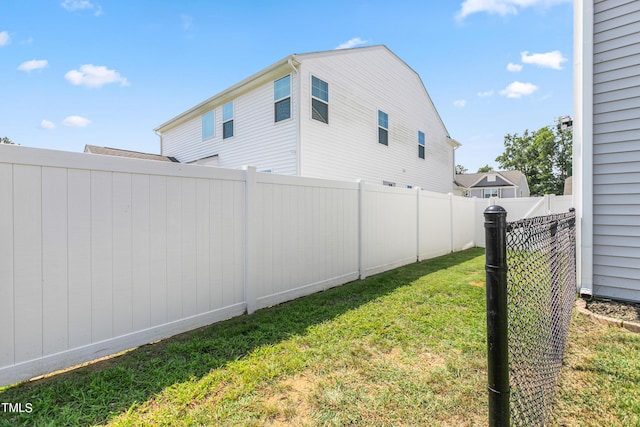 view of yard with a fenced backyard