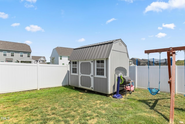 view of shed with a fenced backyard