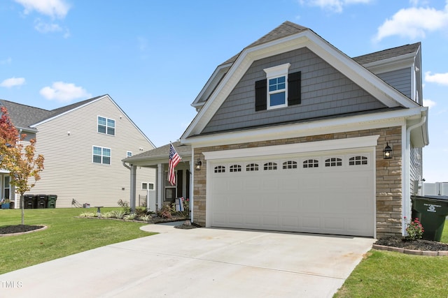 view of front of property featuring stone siding, concrete driveway, and a front yard