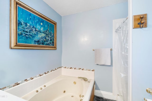 bathroom featuring a bath and a textured ceiling