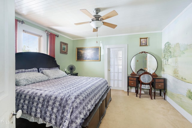 carpeted bedroom with ceiling fan and ornamental molding