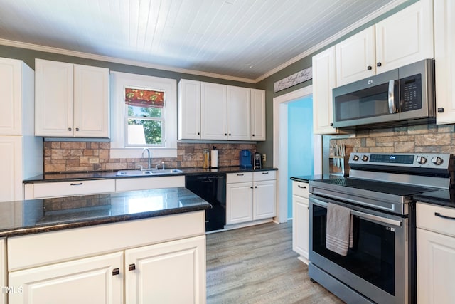 kitchen featuring stainless steel appliances, sink, light wood-type flooring, and white cabinetry