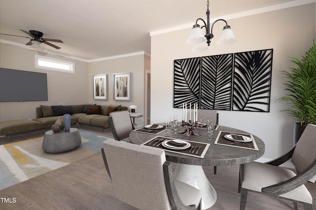 dining area with ceiling fan with notable chandelier, ornamental molding, and wood-type flooring