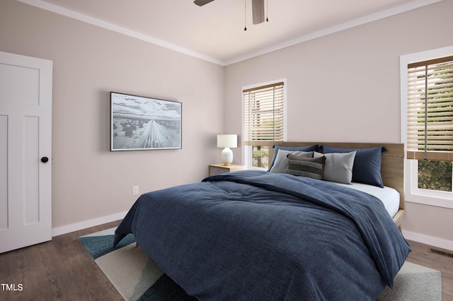 bedroom featuring crown molding, hardwood / wood-style flooring, and ceiling fan