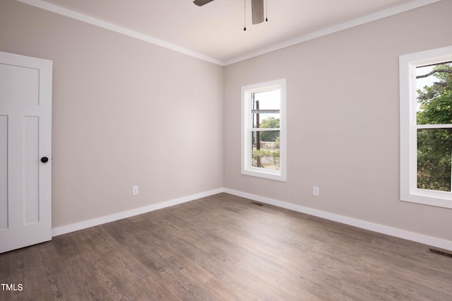 spare room with ornamental molding, ceiling fan, and dark hardwood / wood-style floors