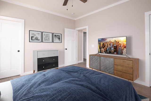 bedroom with ceiling fan and light hardwood / wood-style floors