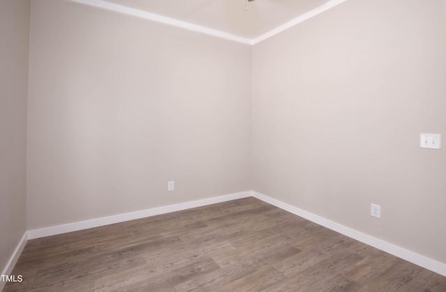 empty room with hardwood / wood-style flooring