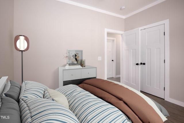 bedroom featuring ornamental molding and hardwood / wood-style flooring