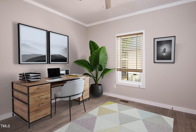 home office with ceiling fan, ornamental molding, and hardwood / wood-style floors