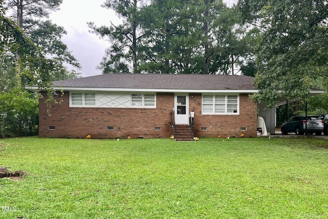 single story home featuring a front yard and a carport