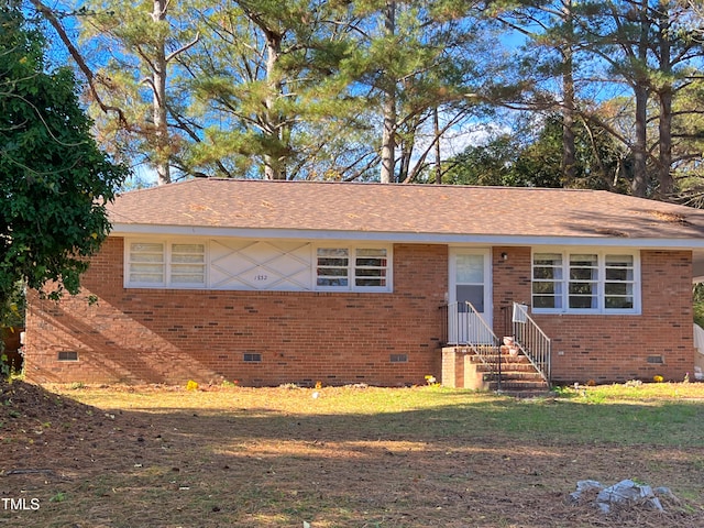 ranch-style house with a front lawn