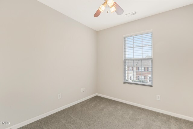 empty room with carpet flooring and ceiling fan