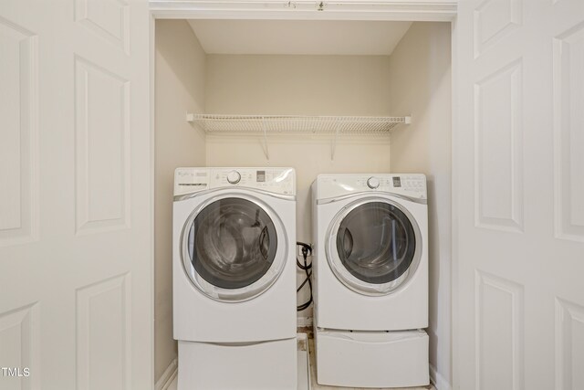 laundry area with separate washer and dryer