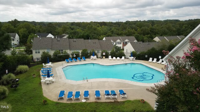 view of swimming pool featuring a patio area