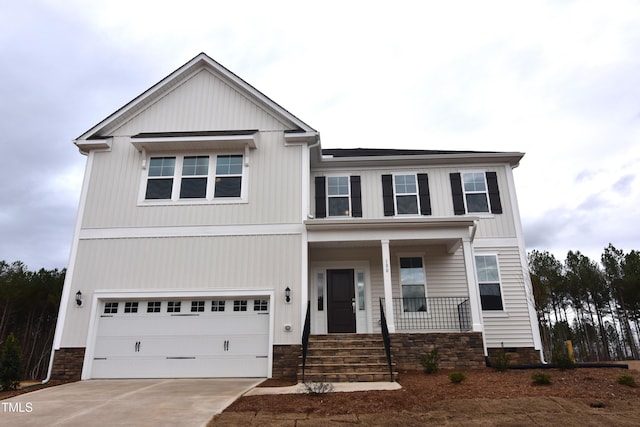 view of front of house with covered porch and a garage