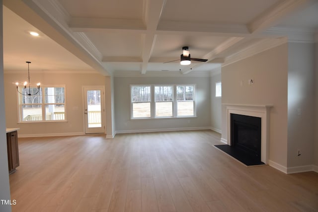 unfurnished living room featuring ceiling fan with notable chandelier, beam ceiling, crown molding, and coffered ceiling