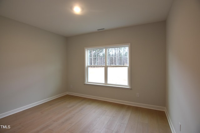 spare room with light hardwood / wood-style floors