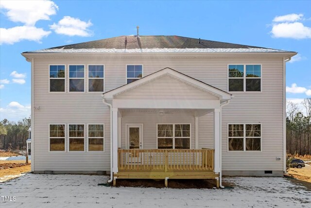 snow covered property featuring crawl space