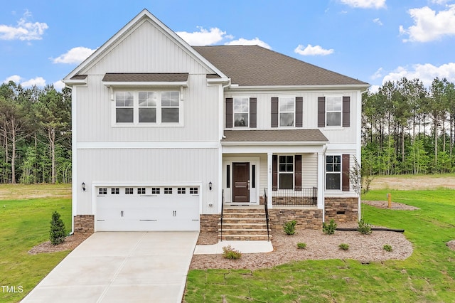 100 Bold Dr, Youngsville, NC 27596 - view of front of home featuring a front yard, covered porch, a garage, and driveway
