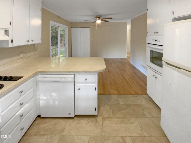 kitchen with light wood-type flooring, white appliances, white cabinetry, kitchen peninsula, and ceiling fan