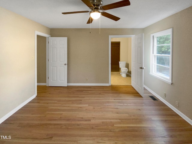 spare room featuring ceiling fan and light wood-type flooring