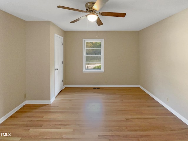 spare room featuring ceiling fan and light hardwood / wood-style flooring