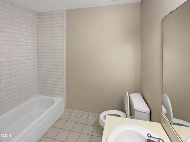 bathroom featuring toilet, sink, and tile patterned floors