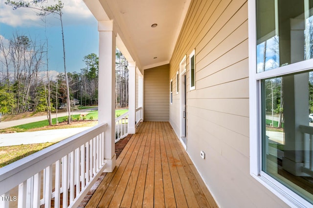 wooden terrace with a porch