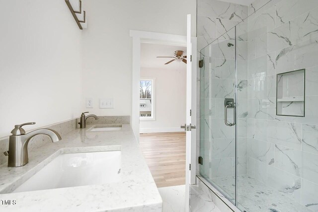 bathroom featuring vanity, hardwood / wood-style flooring, an enclosed shower, and ceiling fan