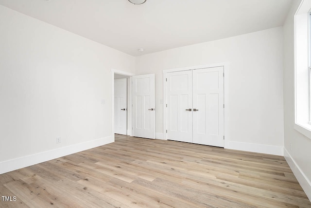 unfurnished bedroom with light hardwood / wood-style flooring