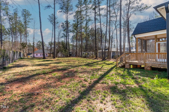 view of yard with a sunroom