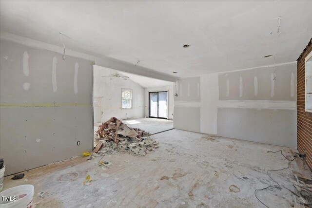 spare room with lofted ceiling