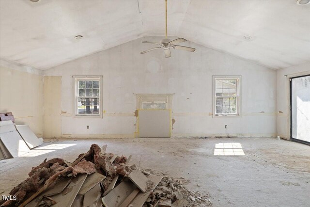 interior space featuring vaulted ceiling, a healthy amount of sunlight, and ceiling fan