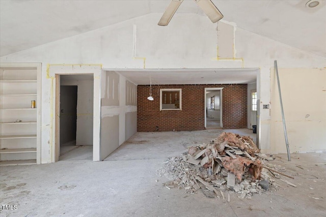 exterior space featuring ceiling fan and vaulted ceiling