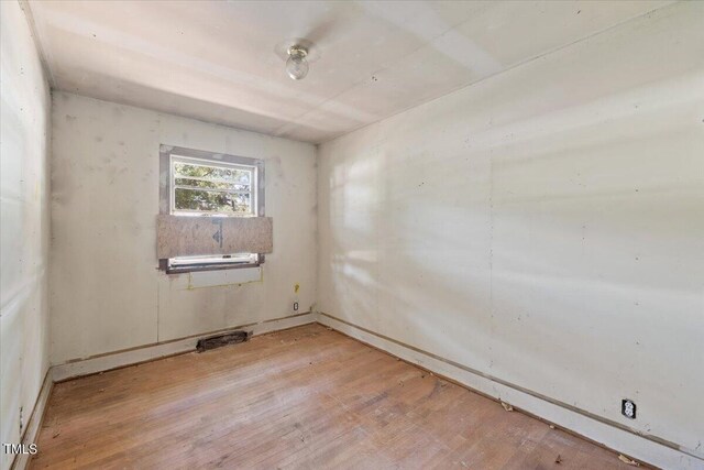 spare room featuring light wood-type flooring