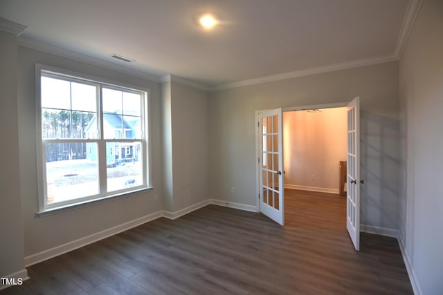 unfurnished room featuring plenty of natural light, french doors, visible vents, and dark wood finished floors