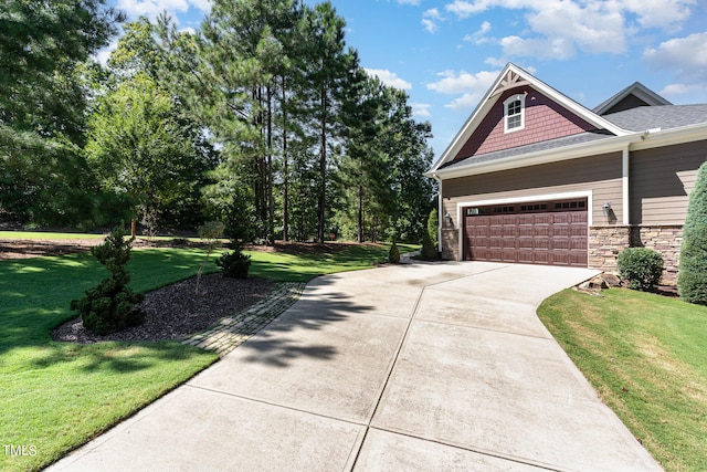 view of side of home featuring a yard and a garage