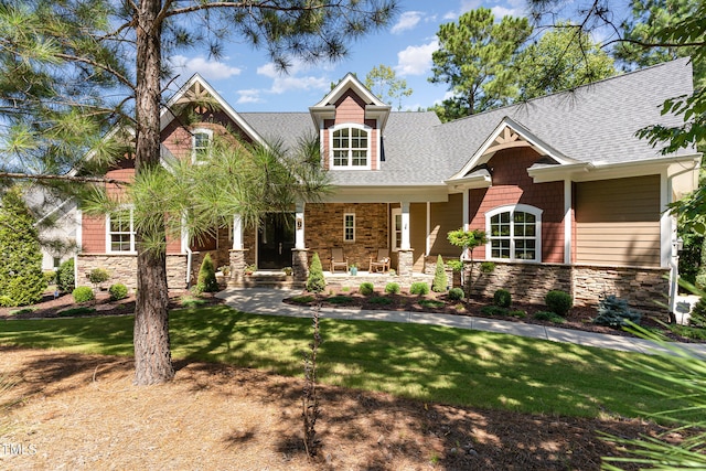 craftsman-style home with a front lawn