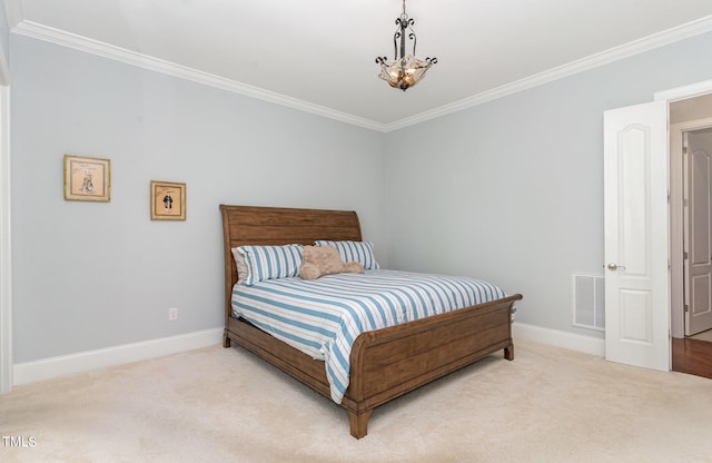 bedroom featuring ornamental molding, carpet floors, and an inviting chandelier