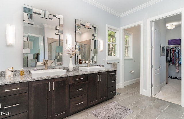 bathroom featuring an enclosed shower, crown molding, and vanity