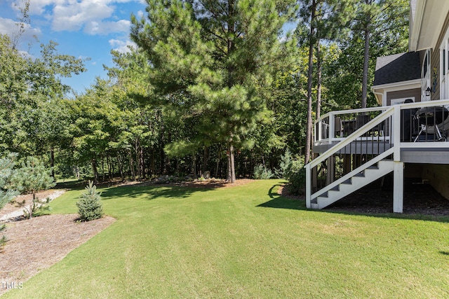 view of yard featuring a wooden deck