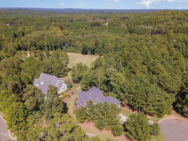 bird's eye view featuring a forest view