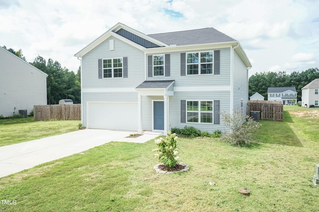 view of front of house with cooling unit, a garage, and a front yard