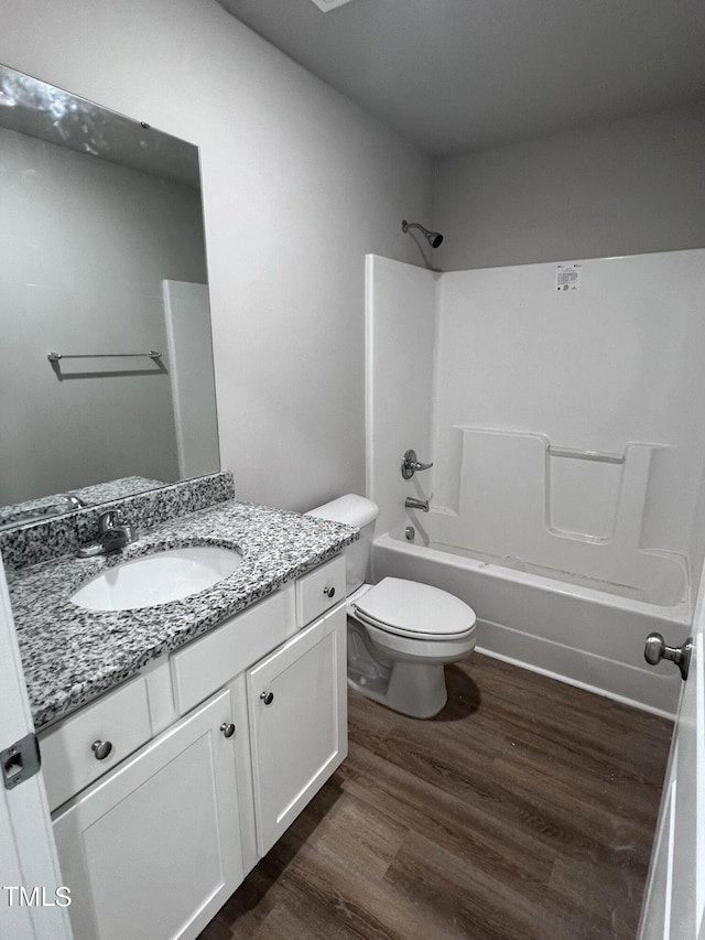 98 Lotus Ave, Smithfield, NC 27577 - full bath featuring toilet, vanity, shower / washtub combination, and wood finished floors