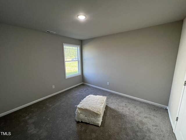 empty room featuring carpet flooring