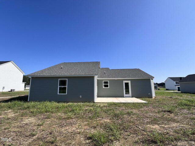 back of property with a patio area