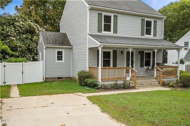 view of front facade featuring a front lawn and a porch