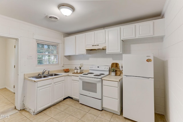 kitchen featuring sink, crown molding, white appliances, light tile patterned flooring, and white cabinets